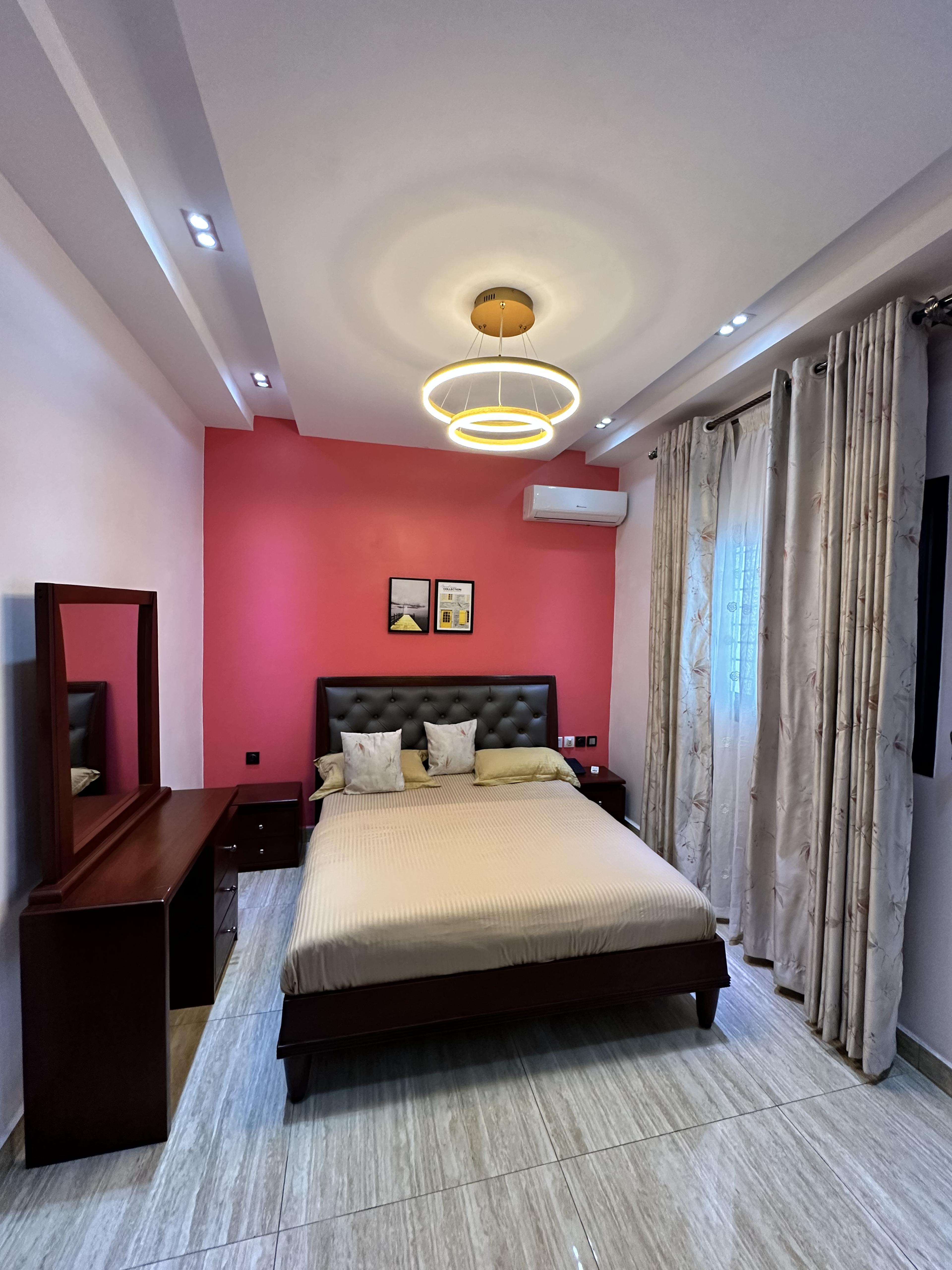 Bedroom with forest-facing windows